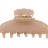 Tan claw clip on a white background