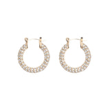 A pair of gold-colored hoop earrings with pave diamond accents