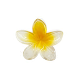 White and yellow hair clip shaped like a flower