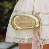 SIMKHAI - Luna Raffia Oval Clutch - Natural