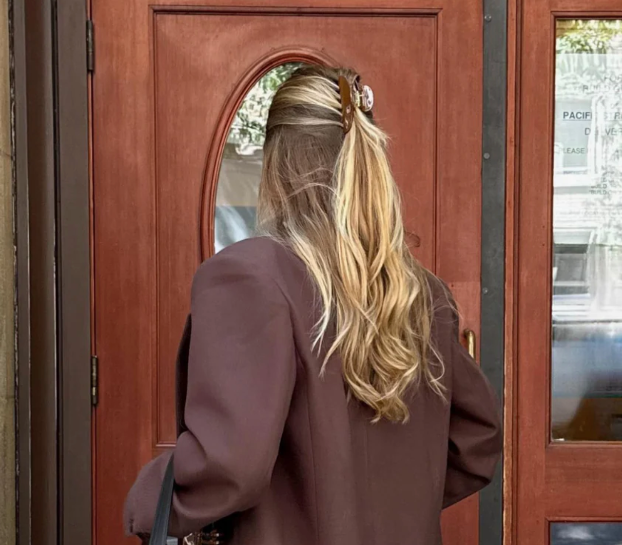 brown hair clip in blonde girls hair