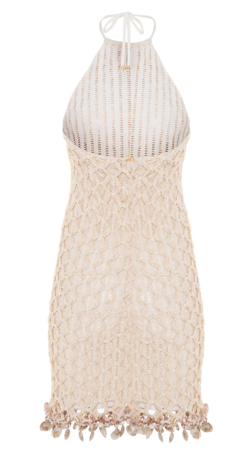 Beige crochet dress with tassel details on a white background