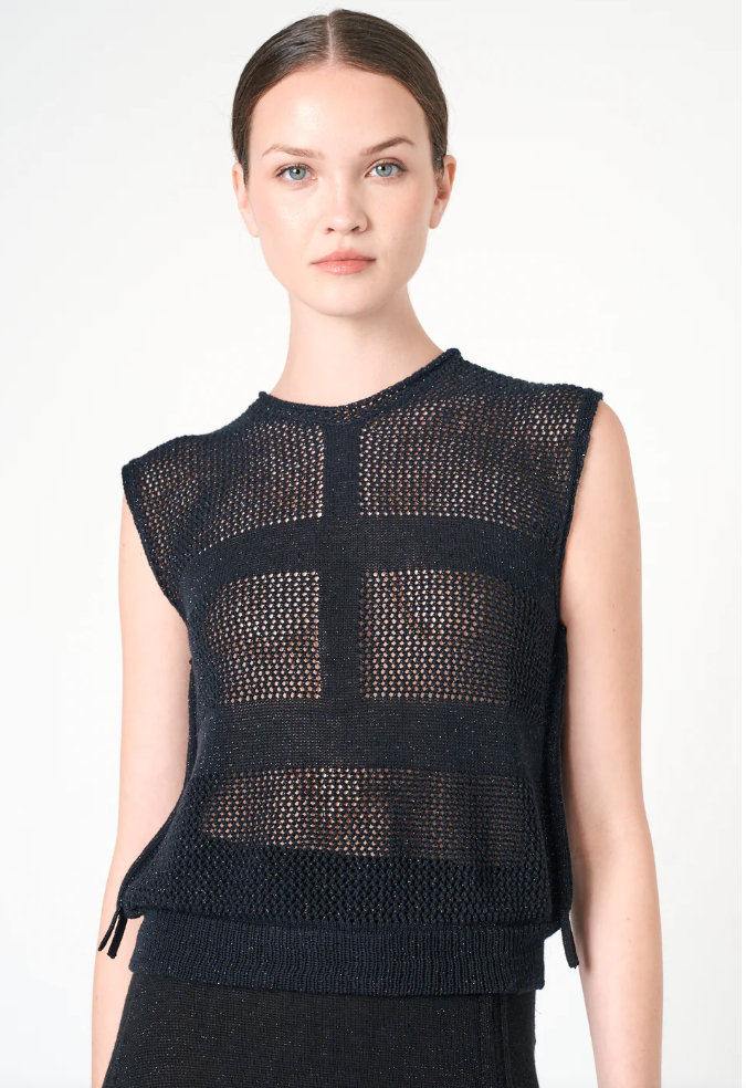 Black sleeveless knit top worn by a model on a white background