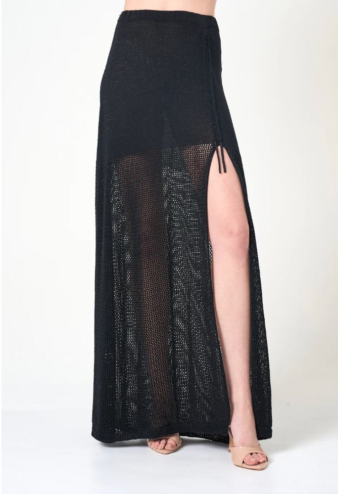 Black mesh skirt with a high slit on a white background