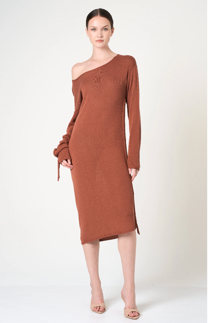 Woman wearing a brown off-shoulder dress on a white background