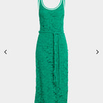 Green lace dress on a light gray background