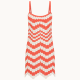 Red and white zigzag patterned dress on a white background