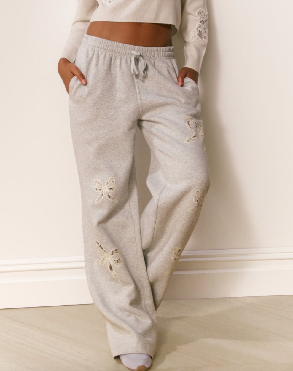 heather grey sweatpants with ivory lace bow detail 