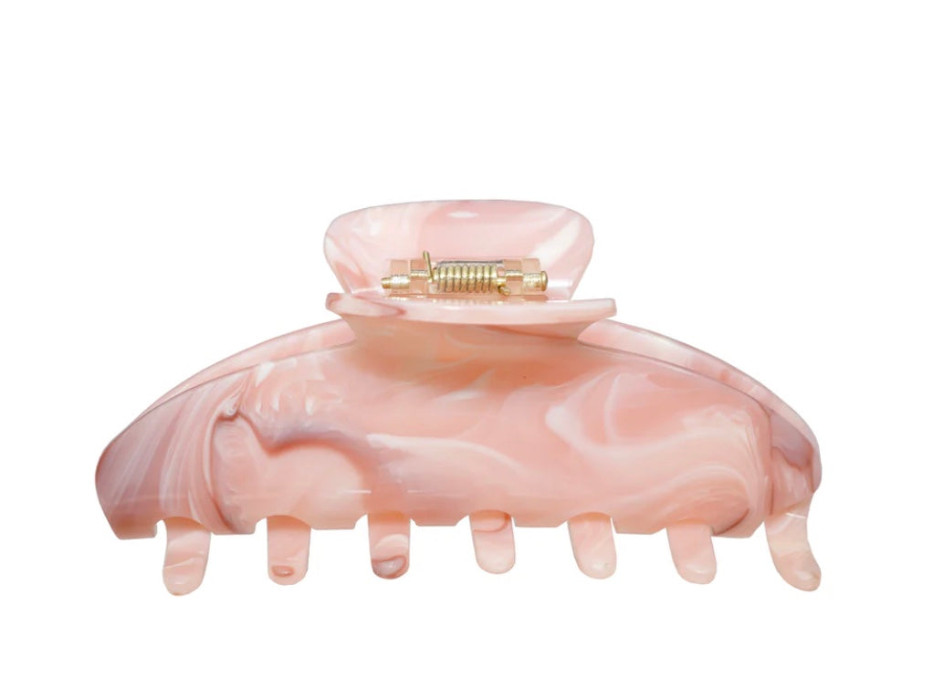 Pink Hair Clip behind a white background