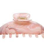 Pink Hair Clip behind a white background
