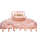 Pink Hair Clip behind a white background