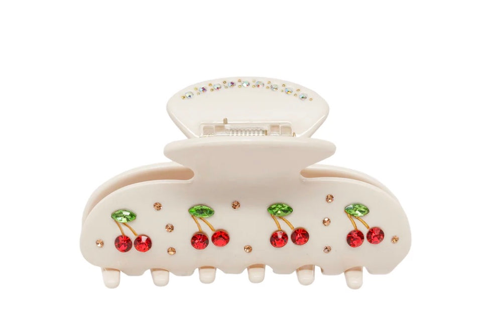 Cream hair claw clip with red cherries on a white background