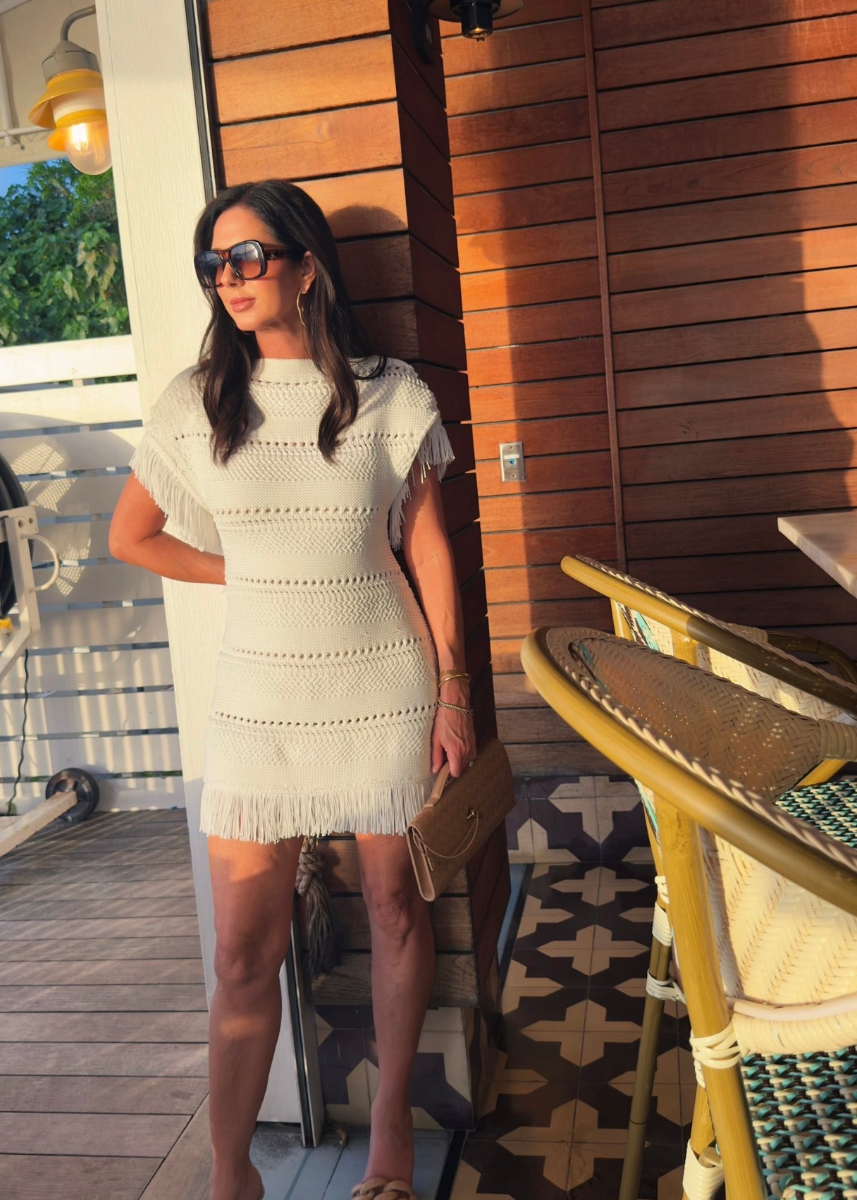 White knit mini dress with fringe sleeves and hem 