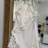 Off white halter mini dress with floral appliqués 