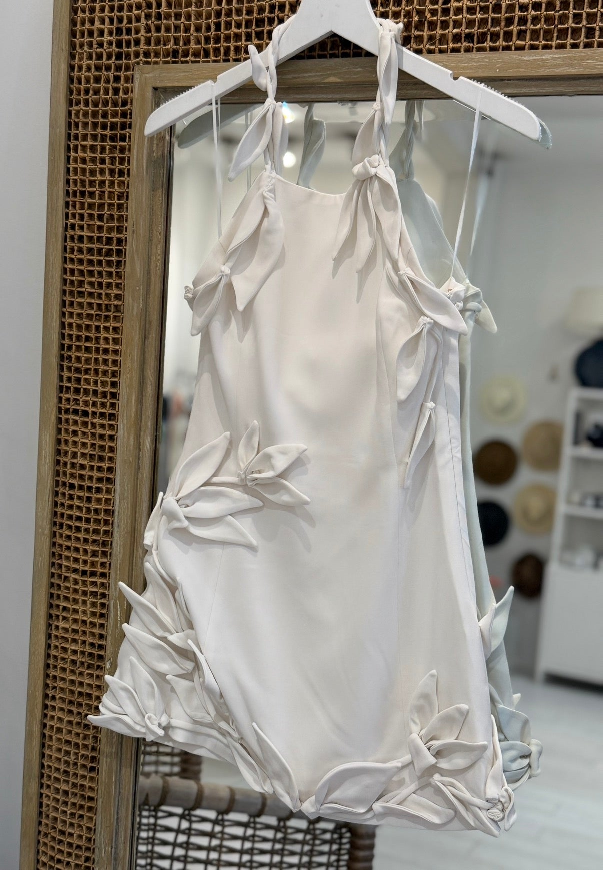 Off white halter mini dress with floral appliqués 