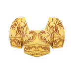 Yellow top with puff sleeves and intricate pattern on a white background