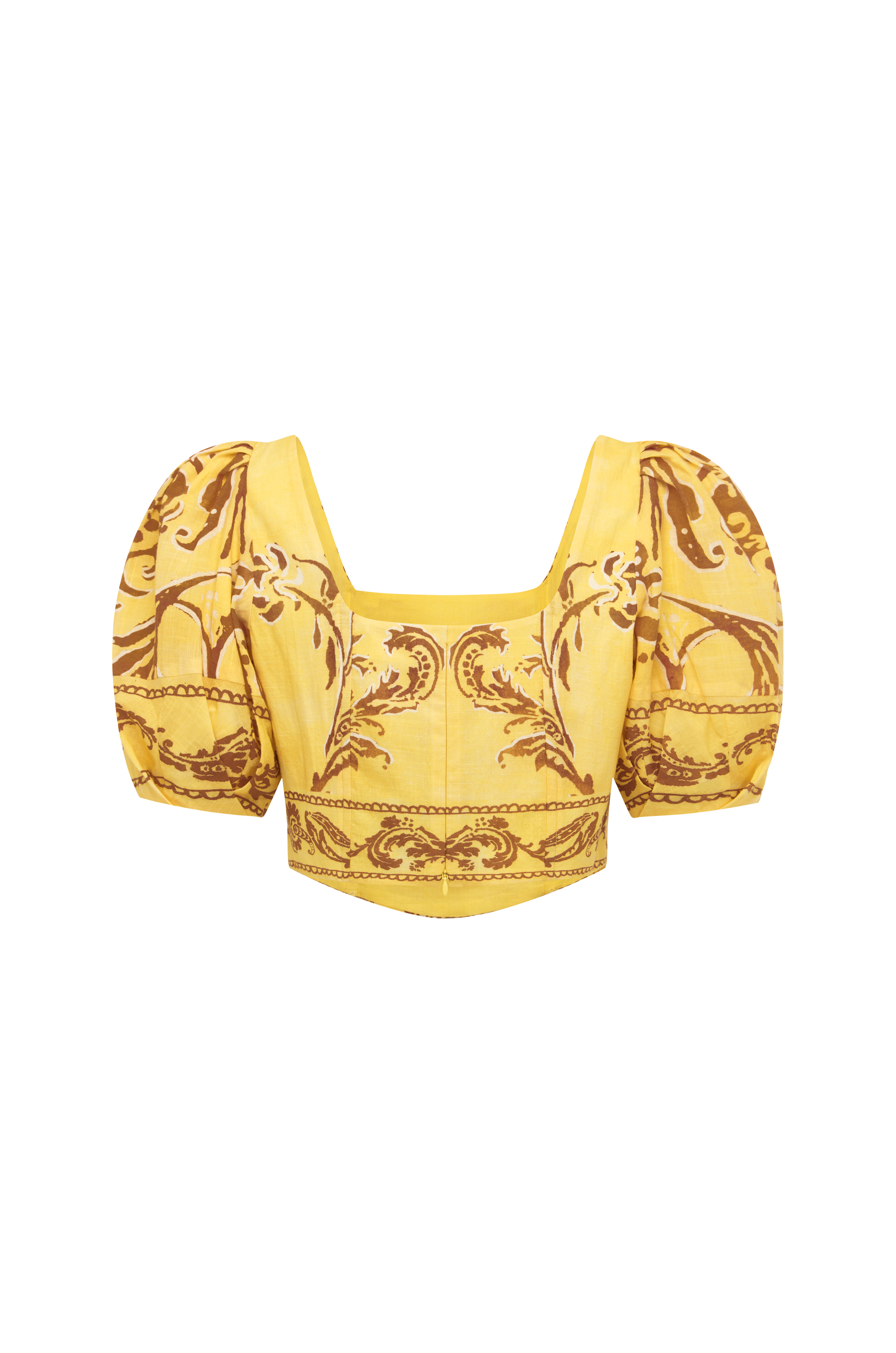 Yellow top with intricate pattern on a white background