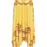 Yellow skirt with intricate brown patterns on a white background