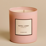 Pink candle with 'Hotel Lobby' label on a beige background