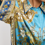 Close-up of a patterned shirt with floral and geometric design