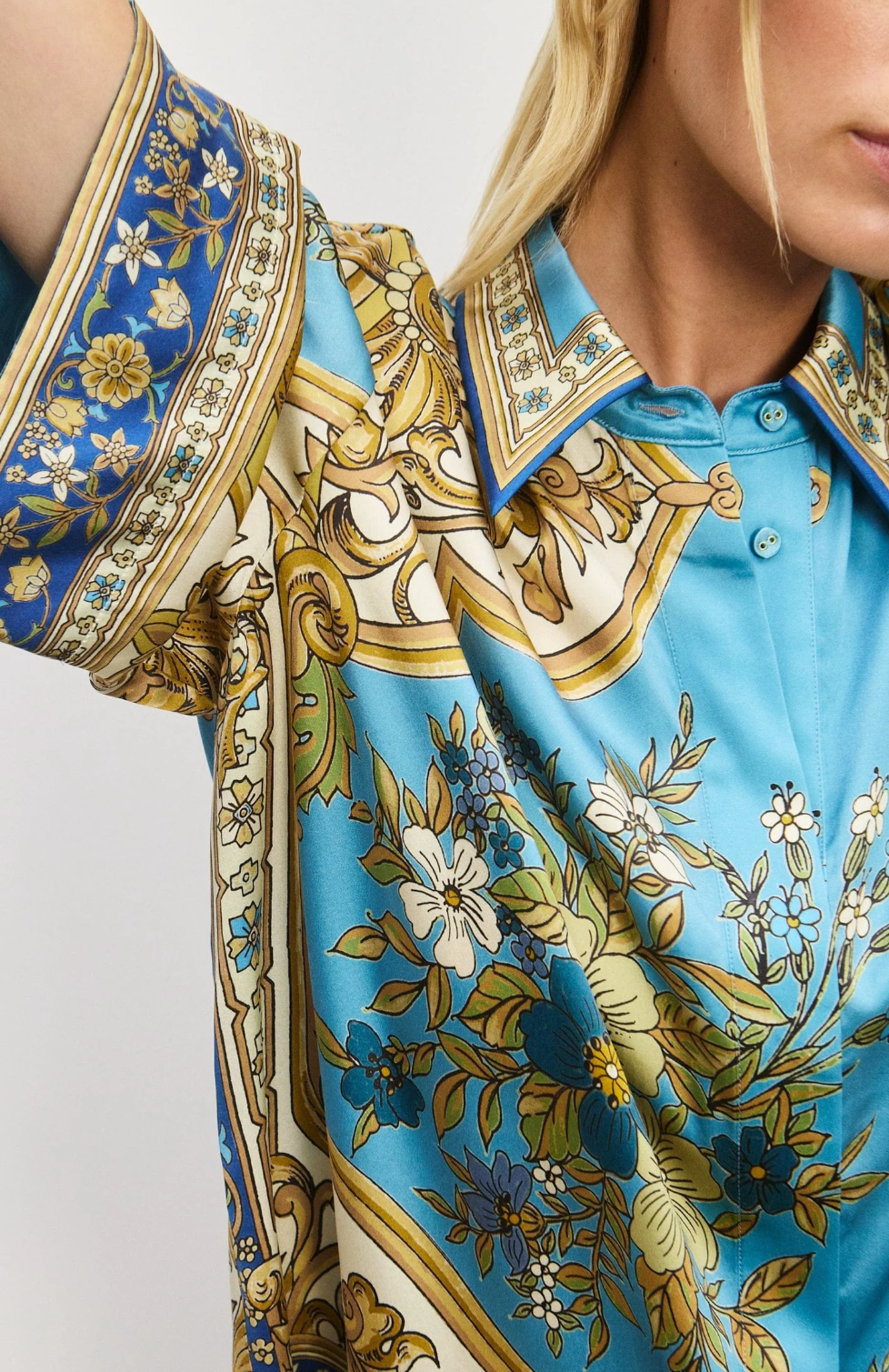Close-up of a patterned shirt with floral and geometric design