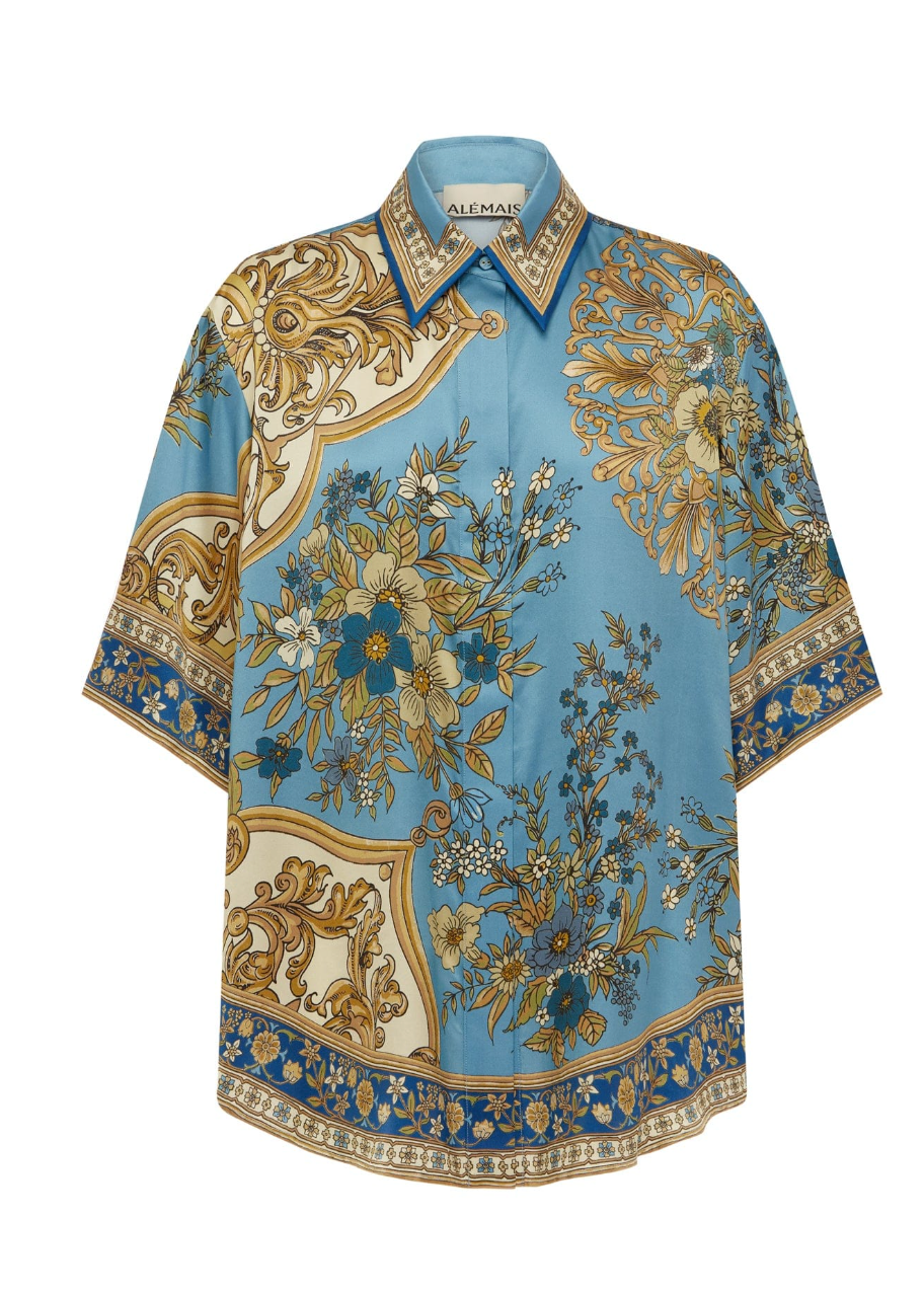 Decorative blouse with floral and baroque patterns on a white background
