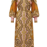 Long patterned dress with orange and gold accents on a white background
