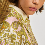 Close-up of a person wearing a patterned garment with intricate designs.