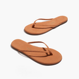Pair of brown sandals on a white background