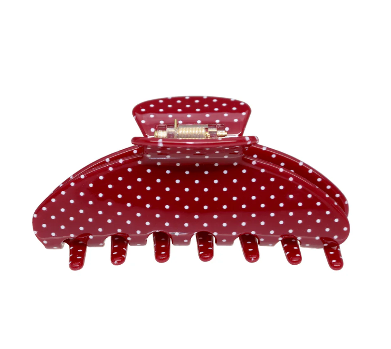 Red polka dot hair clip on a white background