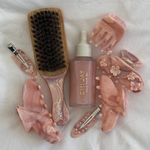 pink chantilly clip laid out among other Emi Jay products