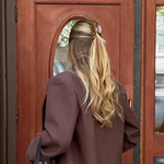 brown hair clip in blonde girls hair