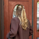brown hair clip in blonde girls hair