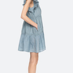 Light blue dress with ruffled straps on a white background