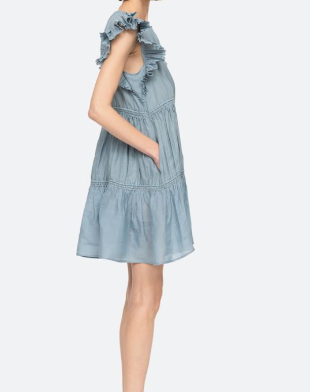 Light blue dress with ruffled straps on a white background