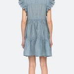 Light blue denim dress with ruffled sleeves on a white background