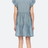 Light blue denim dress with ruffled sleeves on a white background