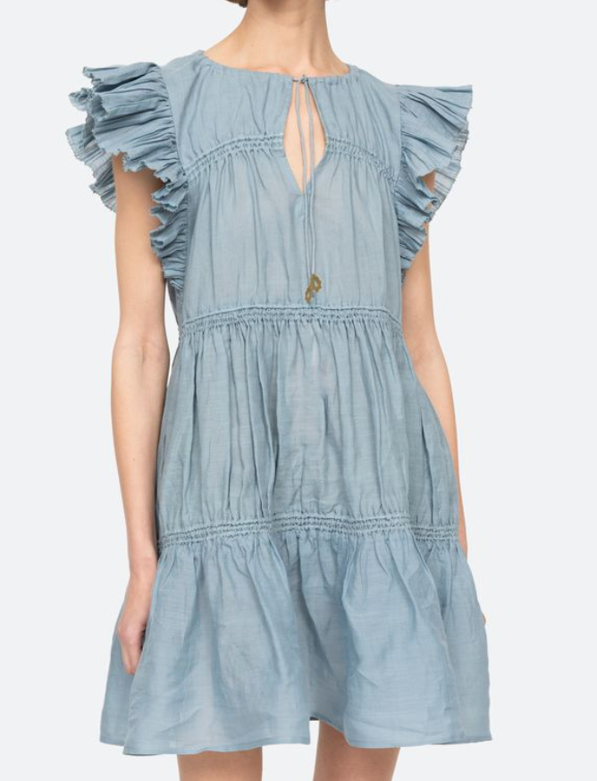 Light blue dress with ruffled sleeves on a white background