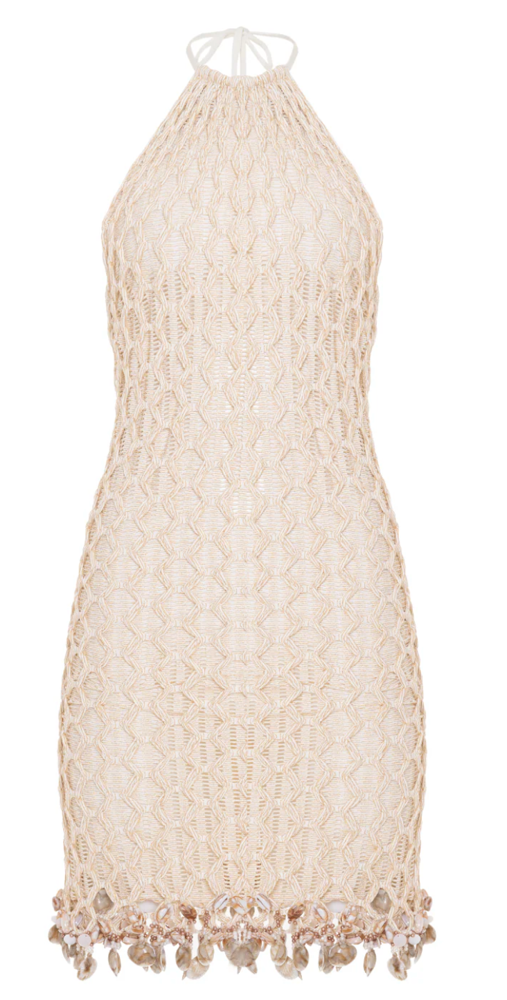 Beige lace dress with fringe details on a white background
