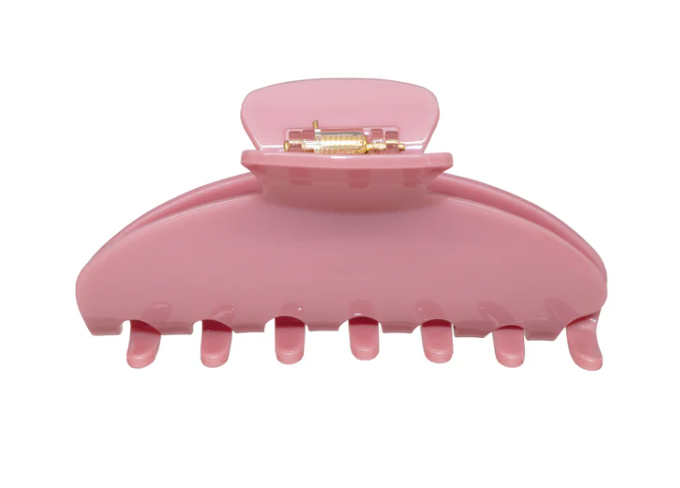 Pink hair clip on a white background