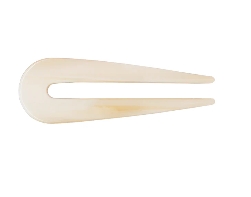 Beige hair clip on a white background