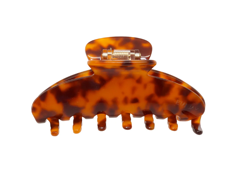 Tortoiseshell hair clip on a white background