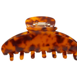 Tortoiseshell hair clip on a white background
