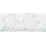 Roll of white fabric with small colorful specks on a white background