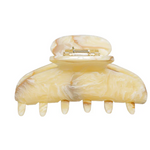Beige marbled hair clip on a white background