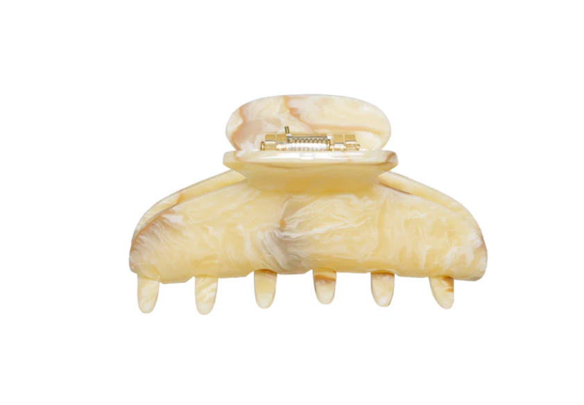 Beige marbled hair clip on a white background