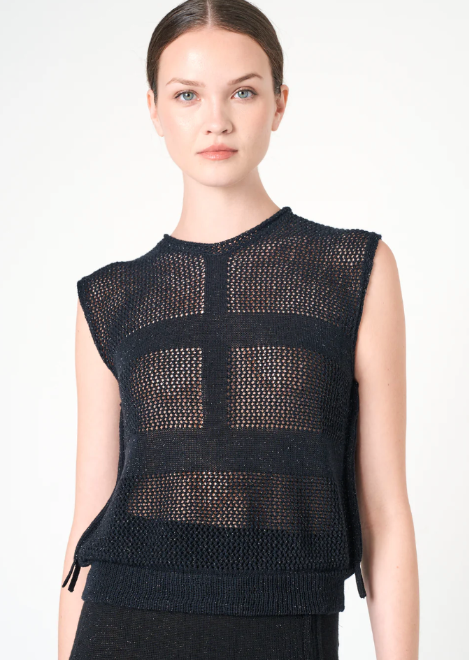 Black sleeveless knit top worn by a model on a white background