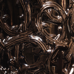 Close-up of ornate, metallic design with intricate patterns