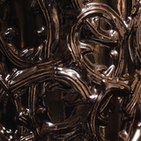 Close-up of ornate, metallic design with intricate patterns