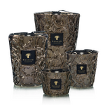 Set of decorative candles with intricate designs and 'Baobab' branding on a white background